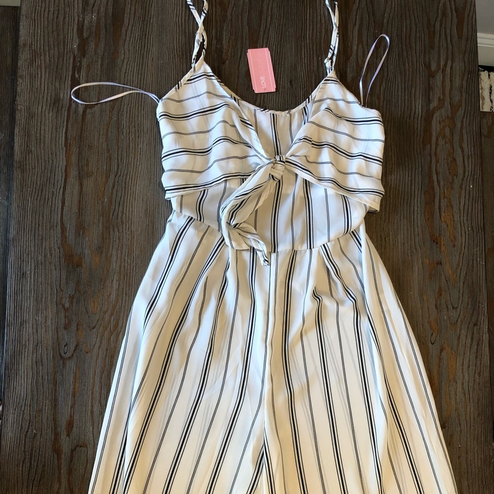 Black and white striped jumpsuit with tie in front